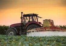 Chlorpyrifos pesticide sprayed by tractor
