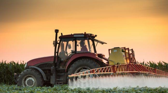 Chlorpyrifos pesticide sprayed by tractor