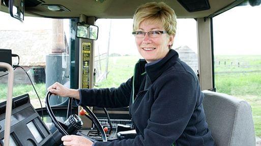woman driving tractor