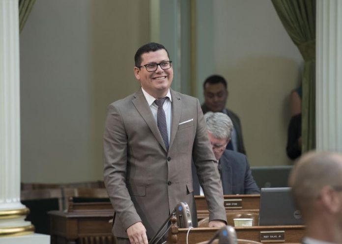 Assemblymember Rudy Salas presents a bill to California Assembly