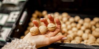 woman holding walnuts