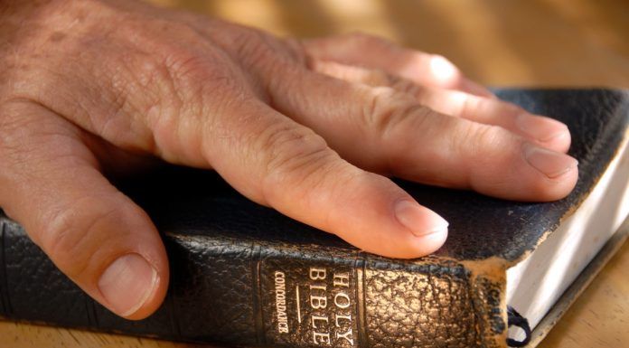 hand on bible