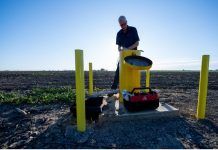 Aaron Cuthbertson measures groundwater levels